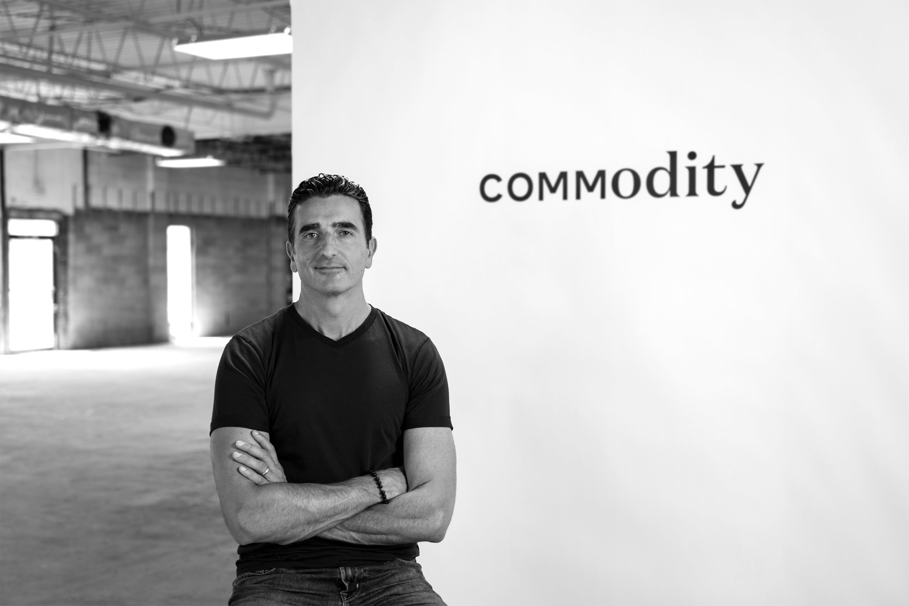 Vicken Arslanian in front of Commodity logo